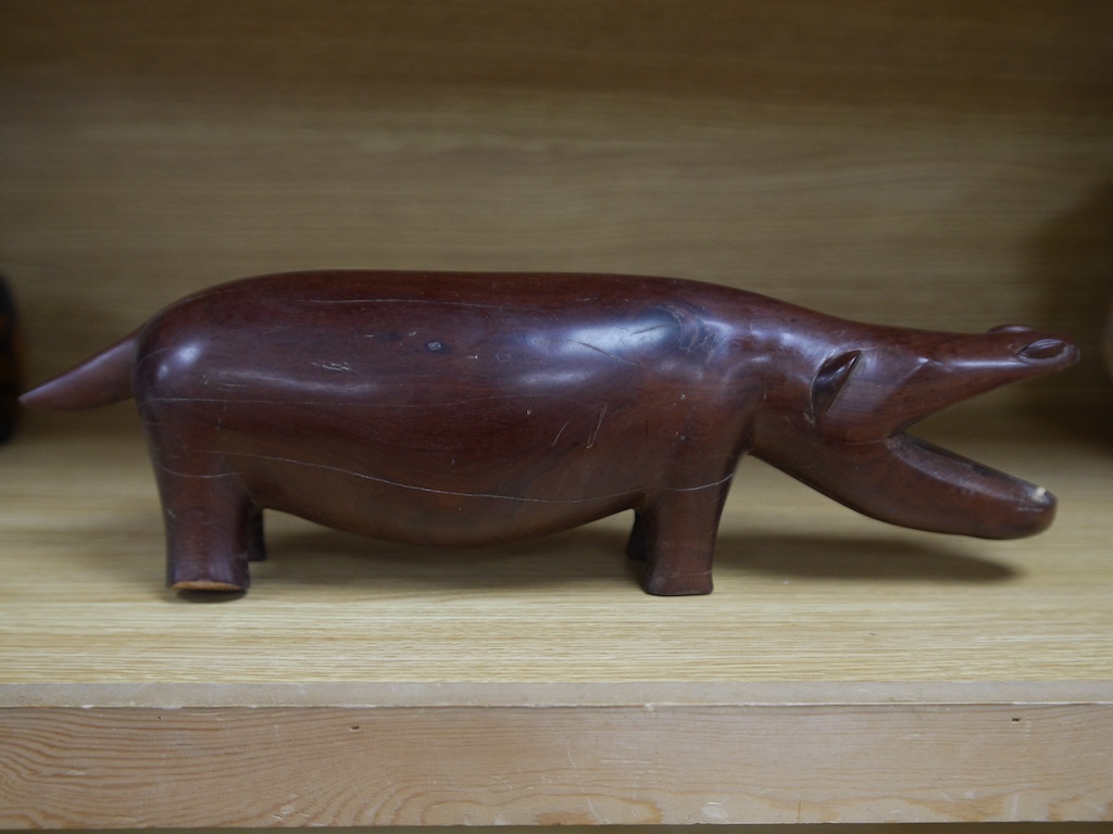 An African carved hardwood model of a hippopotamus, 45cm wide. Condition - poor to fair